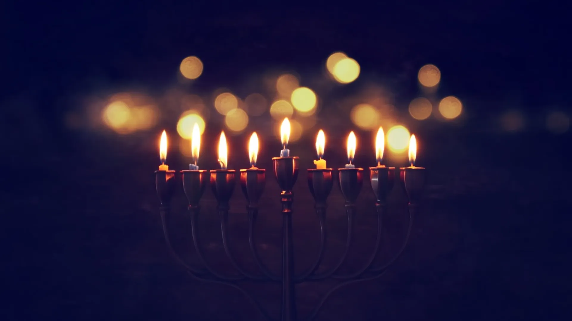 lit-menorah-in-darkness